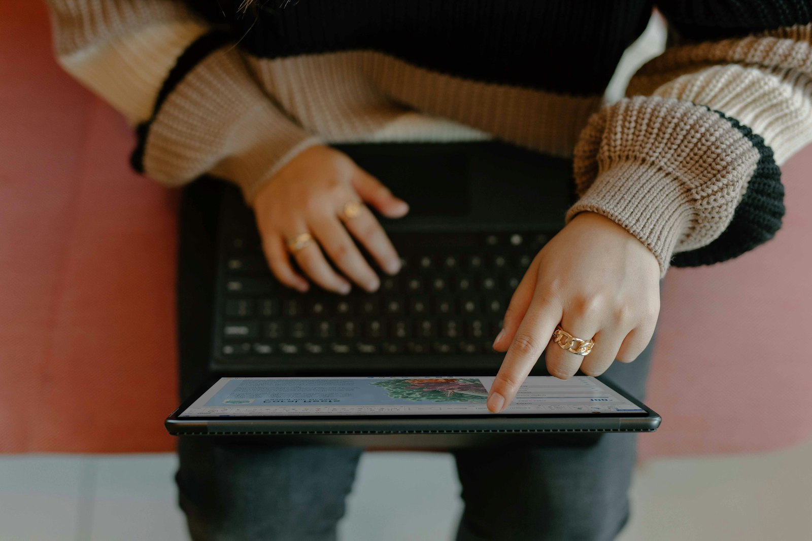 Person typing on a laptop, refining written content