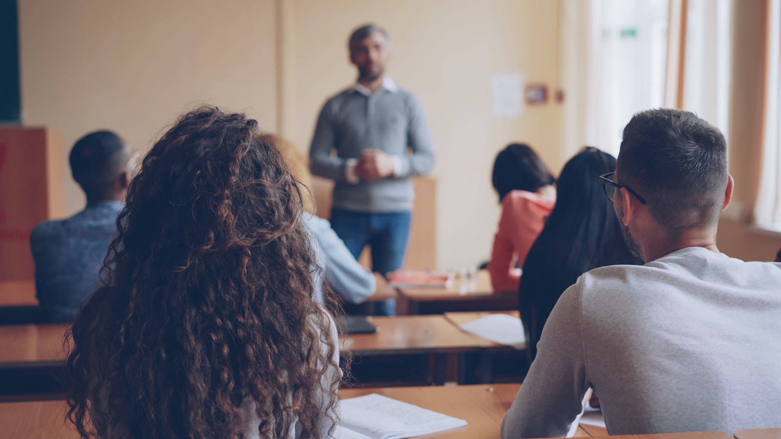 A teacher giving feedback in a classroom setting